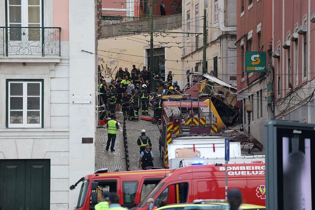 Police and firefighters work on the site of a funicular railway accident in Lisbon, on September 3, 2025. The accident of a funicular railway caused several dead and seriously injured in Lisbon, announced the Portugal's President of the Republic. (Photo by PATRICIA DE MELO MOREIRA / AFP) (Photo by PATRICIA DE MELO MOREIRA/AFP via Getty Images)          
