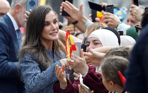 epa13300100 Spain's Queen Letizia (L) greets the crowd waiting at the Town Hall as they arrive in Ceuta, Spain, 13 October 2026. This is the Spanish royal couple's first visit to Spain's North African enclaves, Ceuta and Melilla.  EPA/CHEMA MOYA