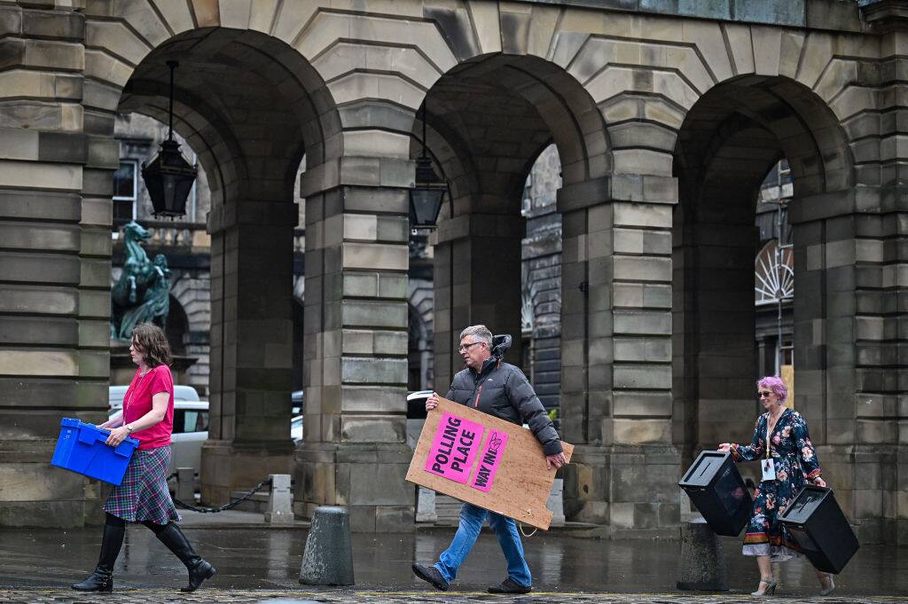 EDINBURGH, SCOTLAND - MAY 04: Staff at Edinburgh City Council move ballot boxes as they're taken for distribution to polling stations on May 4, 2021 in Edinburgh, Scotland. Political party leaders have been out campaigning in the final two day before voters go to the polls open on Thursday in the Scottish Parliamentary election. (Photo by Jeff J Mitchell/Getty Images)