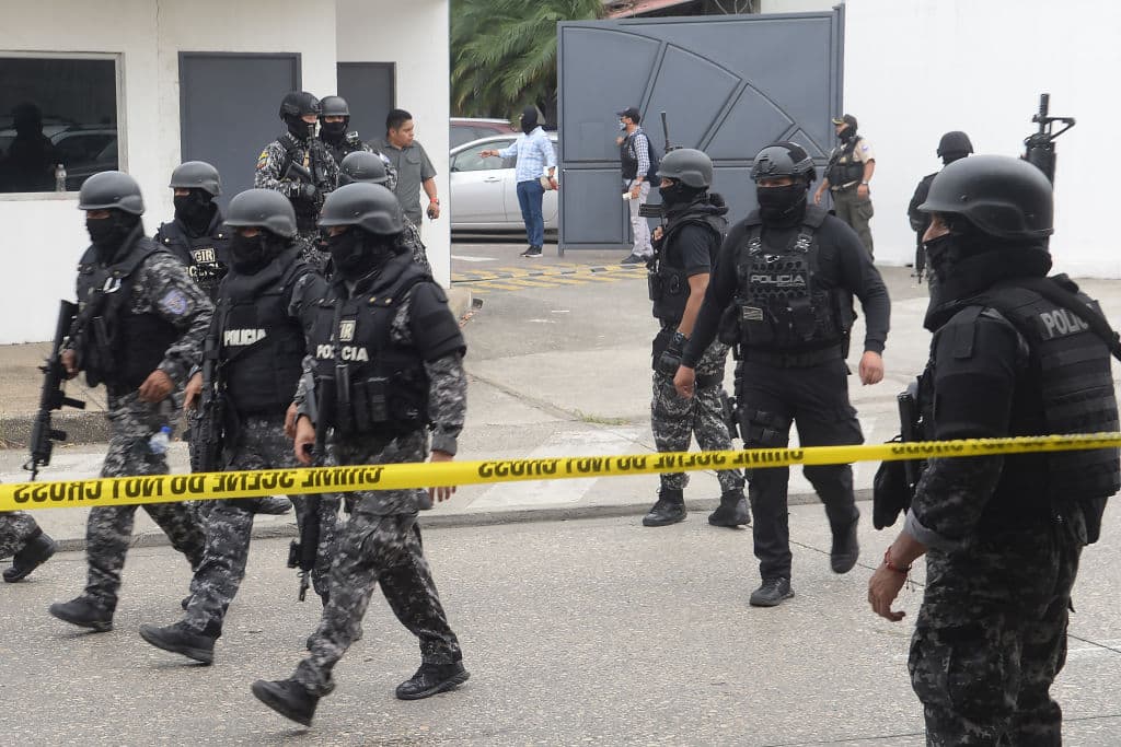 GUAYAQUIL, ECUADOR - JANUARY 09: Police and soldiers take security measures as Ecuadorian police arrest several armed men who broke into the set of a public television channel after Ecuador president declares 'internal armed conflict,' orders military operations against organized crime groups in Guayaquil, Ecuador on January 09, 2024. Police in Ecuador said they have arrested several armed men who broke into the set of a public television channel Tuesday during a live broadcast and forced the staff to lie and sit on the floor as shots and yelling were heard in the background. Ecuador's police chief, Cesar Augusto Zapata confirmed that the hostages were released and "taken to safety" and described the incident as a "terrorist act." (Photo by Jose Orlando Sanchez Lindao/Anadolu via Getty Images)