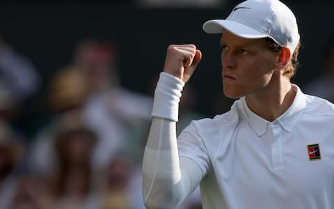 epa12236059 Jannik Sinner of Italy celebrates winning the third set during the Men's Singles final match against Carlos Alcaraz of Spain at the Wimbledon Championships, Wimbledon, Britain, 13 July 2025.  EPA/NEIL HALL  EDITORIAL USE ONLY