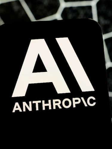 A smartphone displays the Anthropic logo against a textured hexagonal background in Creteil, France, on April 8, 2026. Anthropic announces the launch of Project Glasswing, a cybersecurity initiative based on the Claude Mythos model to detect and remediate vulnerabilities in critical open-source software. (Photo by Samuel Boivin/NurPhoto via Getty Images)