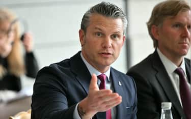 US Secretary of Defense Pete Hegseth speaks ahead of a meeting with French Minister of the Armed Forces and Veterans on the sidelines of a ceremony marking the 82nd anniversary of the D-Day landings at the Normandy American Cemetery in Colleville-sur-Mer, northwestern France, on June 6, 2026. (Photo by LOU BENOIST / AFP)