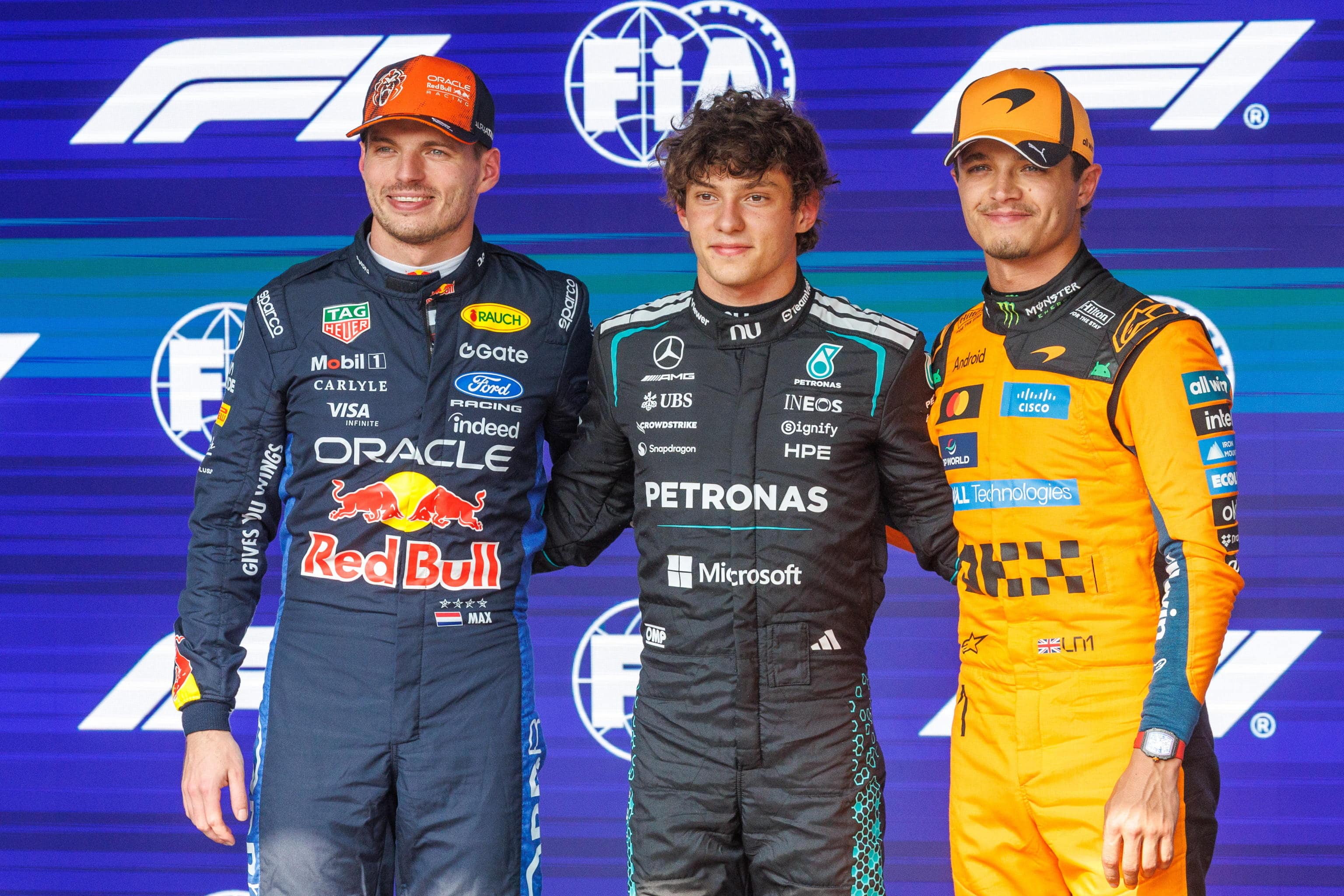 epa13118996 (L-R) Second position Red Bull Racing driver Max Verstappen of Netherlands, pole position Mercedes driver Andrea Kimi Antonelli of Italy, and third position McLaren driver Lando Norris of Britain pose for a photo after the Qualifying for the Formula One Belgian Grand Prix, in Francorchamps, Belgium, 18 July 2026. The 2026 Formula 1 Belgian Grand Prix is held at the Circuit de Spa-Francorchamps racetrack on 19 July 2026.  EPA/OLIVIER MATTHYS