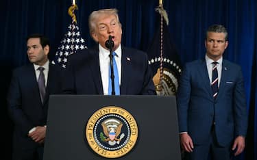 US President Donald Trump, alongside Secretary of State Marco Rubio (L) and US Secretary of Defense Pete Hegseth (R), speaks to the press following US military actions in Venezuela, at his Mar-a-Lago residence in Palm Beach, Florida, on January 3, 2026. President Trump said Saturday that US forces had captured Venezuelan leader Nicolas Maduro after launching a "large scale strike" on the South American country. (Photo by Jim WATSON / AFP via Getty Images)