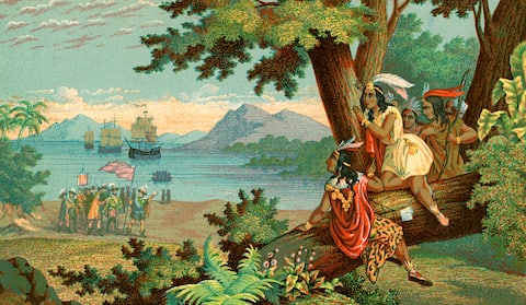 Vintage illustration of Christopher Columbus arriving in the New World; chromolithograph, 1900. (Photo by GraphicaArtis/Getty Images)
