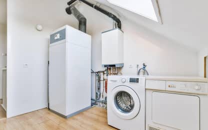 Room with household appliances under a bright window