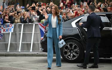 Britain's Catherine, Princess of Wales waves as she arrives at Reggio Emilia town hall during a two-day visit in Italy, on May 13, 2026. (Photo by Marco BERTORELLO / POOL / AFP)