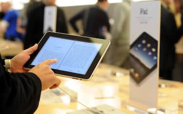 A person uses an iPad at the Apple Store on Fifth Avenue in New York, Saturday, April 3, 2010.  Eager customers have been lining up outside Apple Stores and some Best Buys to be among the first to buy one as sales started at 9 a.m. Saturday in each time zone. (AP Photo/Diane Bondareff)