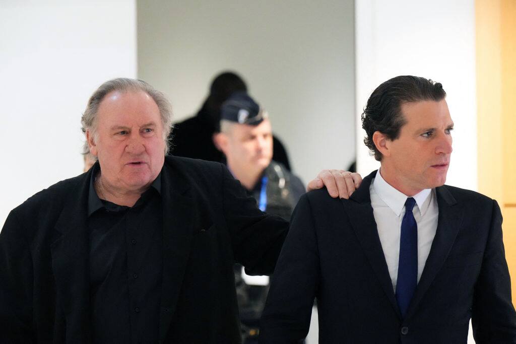 French actor Gerard Depardieu (L) and his lawyer Jeremie Assous arrive for his trial in which he is charged with sexually assaulting two women during a film shoot in 2021, at Paris criminal court on March 25, 2025. Depardieu, 76, who has made more than 200 films and television series, has been accused of improper behaviour by around 20 women but this is the first case to come to trial. The two plaintiffs -- Amelie, 54, a set dresser, and Sarah (name changed), 34, an assistant director -- allege sexual assault during the filming in 2021 of "Les Volets Verts" ("The Green Shutters") by director Jean Becker. (Photo by Dimitar DILKOFF / AFP) (Photo by DIMITAR DILKOFF/AFP via Getty Images)          