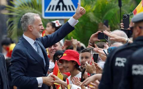epa13300137 Spain's King Felipe VI greets the crowd waiting at the Town Hall as they arrive in Ceuta, Spain, 13 October 2026. This is the Spanish royal couple's first visit to Spain's North African enclaves, Ceuta and Melilla.  EPA/CHEMA MOYA