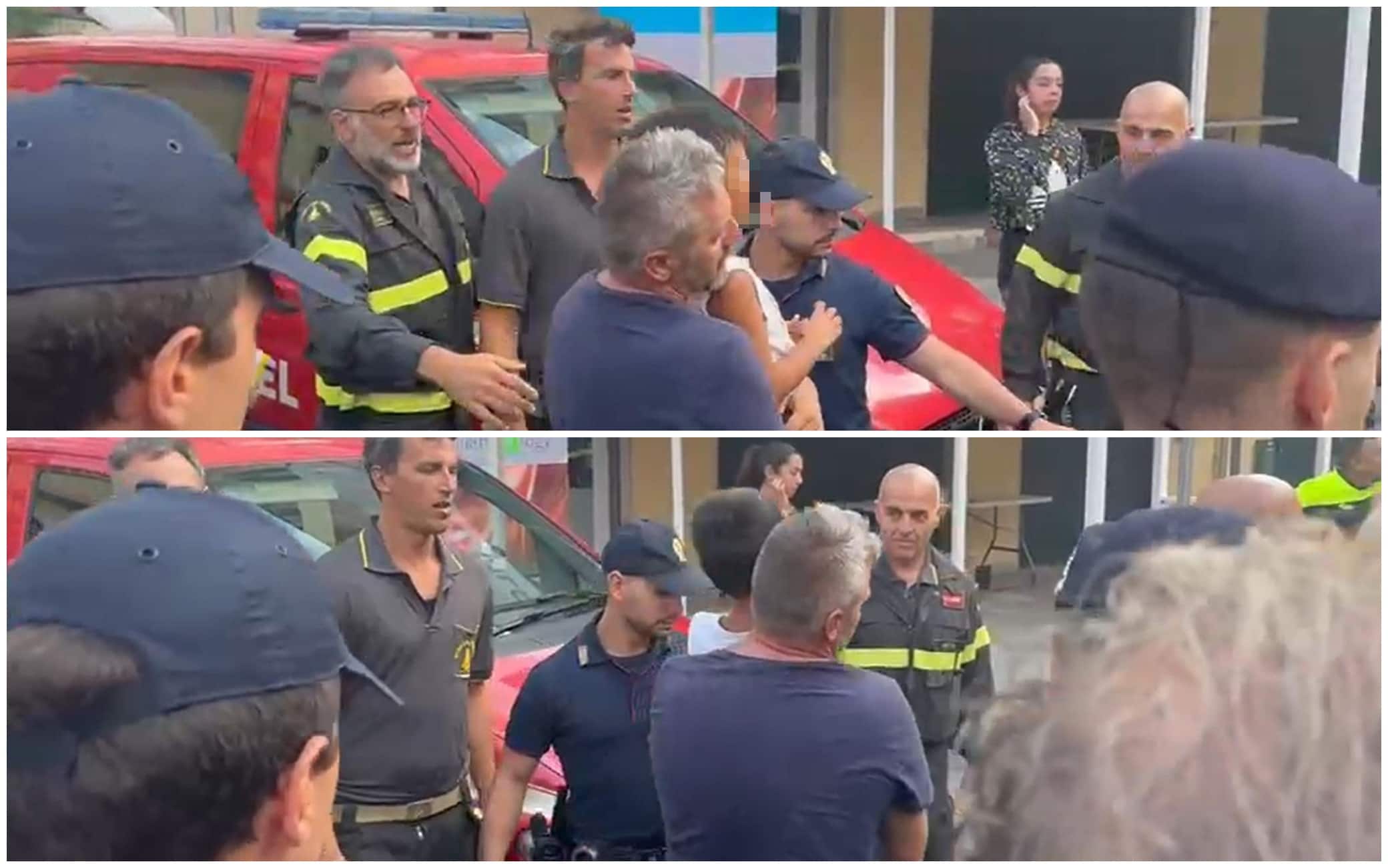 I soccorritori tengono in braccio il bambino