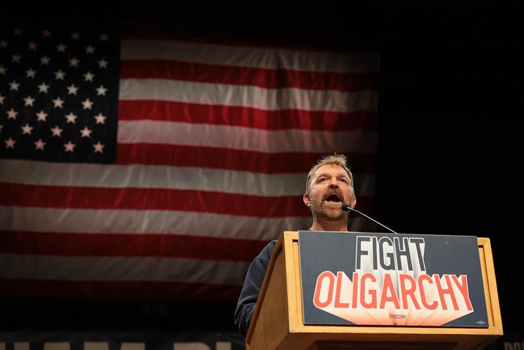 ORONO, MAINE - MAY 24: Democratic U.S. Senate candidate Graham Platner speaks at a “Fighting Oligarchy” tour stop held by Sen. Bernie Sanders (I-VT) at the Collins Center for the Arts on the University of Maine campus on May 24, 2026 in Orono, Maine. Platner is the presumptive Democratic nominee and will face incumbent Sen. Susan Collins (R-ME) for Maine's U.S. Senate seat in the general election.  (Photo by Joe Raedle/Getty Images)