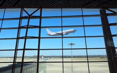 flight departing,the looking glass of modern airport terminal