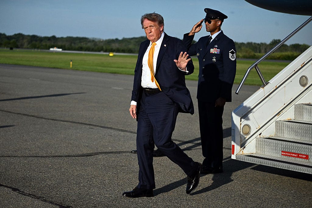 US President Donald Trump waves to reporters while stepping off Air Force One at Morristown Municipal Airport in Morristown, New Jersey on September 4, 2026. Trump will be spending the weekend at his golf club in Bedminster, New Jersey. (Photo by Jim WATSON / AFP via Getty Images)