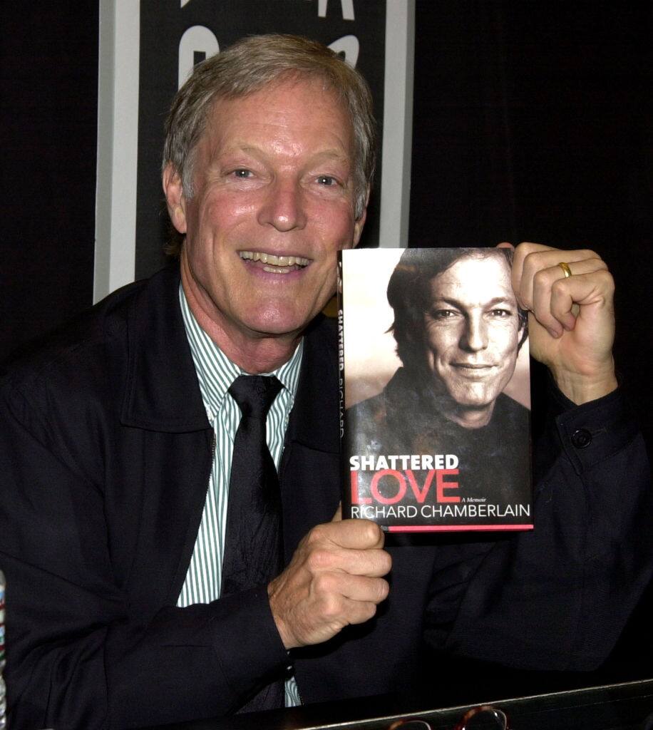 Richard Chamberlain with a copy of his memoir "Shattered Love" (Photo by Mike Guastella/WireImage)