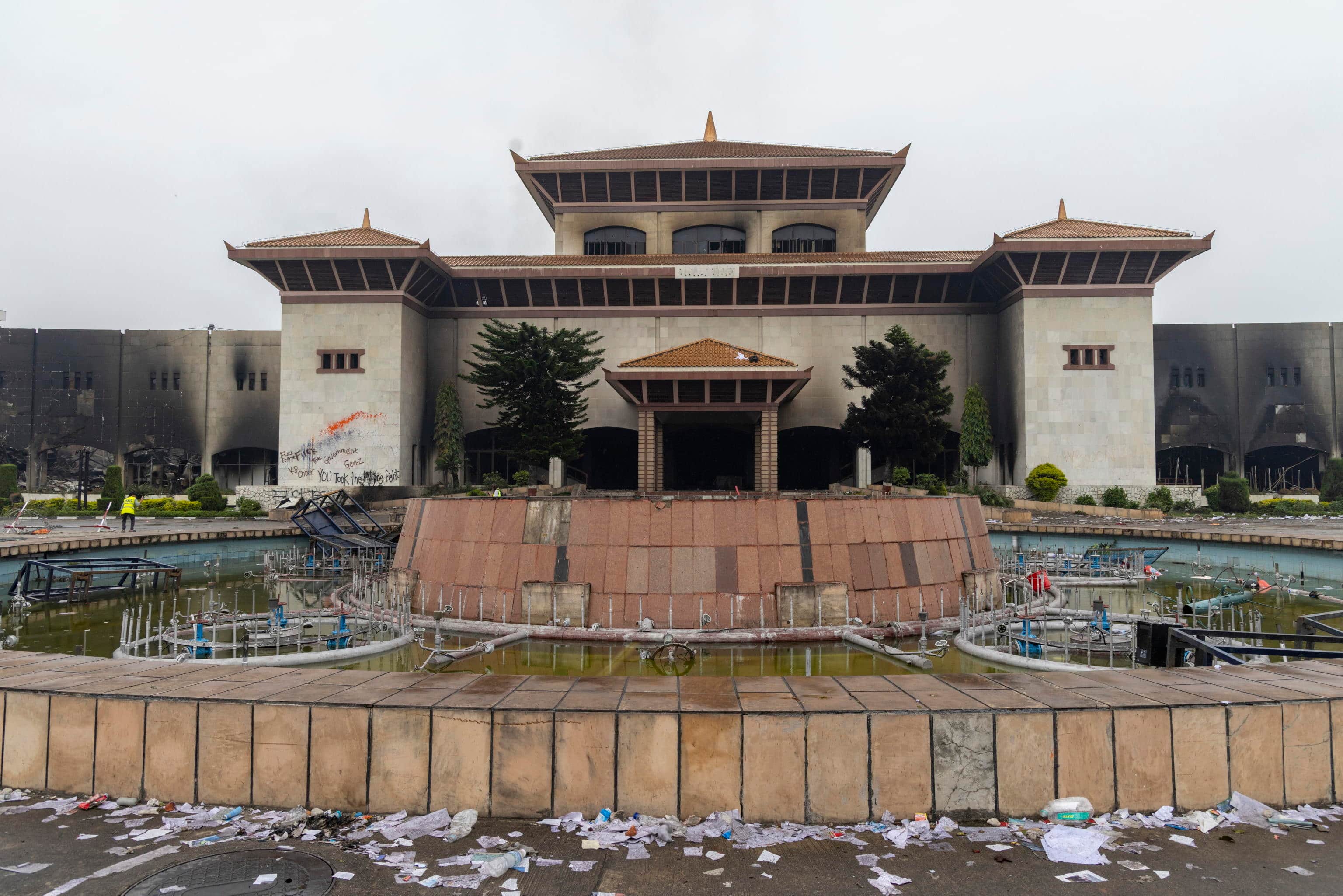 epa12366472 A view of the destroyed Parliament building in Kathmandu, Nepal, 10 September 2025, following violent demonstrations that destroyed major government buildings, including the Parliament and the government secretariat, Singha Durbar. The protest, which began on 08 September, was led by a group of youths identifying themselves as Generation Z, against corruption and a government-imposed social media ban.  EPA/NARENDRA SHRESTHA