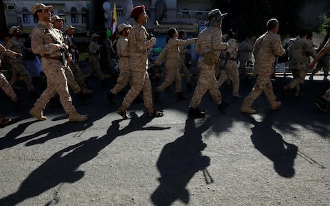 epa10915222 Houthi fighters march during a military parade in solidarity with Palestinians in the Gaza Strip, in Sana'a, Yemen, 12 October 2023. The top leader of the Houthis movement, Abdul-Malik al-Houthi, has warned that his movement will stand ready to engage in hostilities against Israel should the United States directly back the Israeli military campaign on the Gaza Strip. Thousands of Israelis and Palestinians have died since the militant group Hamas launched an unprecedented attack on Israel from the Gaza Strip on 07 October 2023, leading to Israeli retaliation strikes on the Palestinian enclave.  EPA/YAHYA ARHAB
