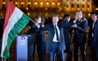 BUDAPEST, HUNGARY - APRIL 12: Peter Magyar (C), lead candidate of the Tisza party, speaks to supporters after polling stations closed during Hungarian parliamentary elections on April 12, 2026 in Budapest, Hungary. Magyar, who has gone into the election with a substantial lead in polls, is seeking to unseat Prime Minister Viktor Orban. (Photo by Janos Kummer/Getty Images)
