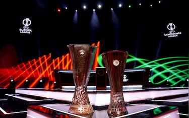 epa12332963 The UEFA Europa League (L) and UEFA Conference League trophies on display before the draws for the league phase of both competitions at the Grimaldi Forum in Monaco, 29 August 2025.  EPA/MOHAMMED BADRA
