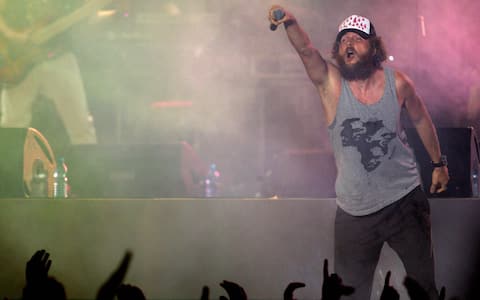 Rome, ITALY:  Italian singer Jovanotti performs during the Live 8 concert in rome inside chariot-racing amphitheater, the Circus Maximus, 02 July 2005 at the start of Live 8 concert.Thousands of fans cheered the start of a Live 8 concert Saturday in Rome joining an unprecedented worldwide relay of 10 concerts demanding the eradication of African poverty.  AFP PHOTO/ Andreas SOLARO  (Photo credit should read ANDREAS SOLARO/AFP via Getty Images)