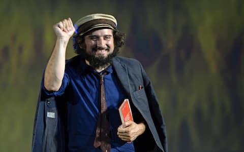 epa03816548 Italian singer-songwriter Vinicio Capossela poses during a photocall at the 66th Locarno International Film Festival in Locarno, Switzerland, 07 August 2013. The festival runs from 07 to 17 August.  EPA/URS FLUEELER