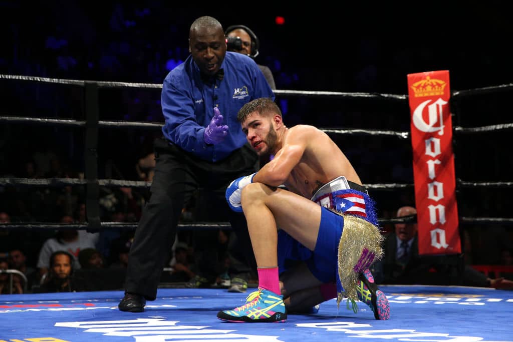 FAIRFAX, VA - OCTOBER 17: Prichard Colon (C) falls to the ring after taking a punch from Terrel Williams in their super welterweights bout at EagleBank Arena on the campus of George Mason University on October 17, 2015 in Fairfax, Virginia. (Photo by Patrick Smith/Getty Images)