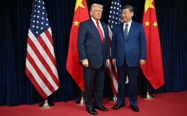 US President Donald Trump (L) and China's President Xi Jinping arrive for talks at the Gimhae Air Base, located next to the Gimhae International Airport in Busan on October 30, 2025. Donald Trump and Chinese leader Xi Jinping will seek a truce in their bruising trade war on October 30, with the US president predicting a "great meeting" but Beijing being more circumspect. (Photo by ANDREW CABALLERO-REYNOLDS / AFP)