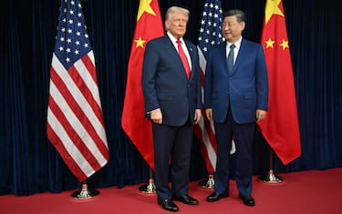 US President Donald Trump (L) and China's President Xi Jinping arrive for talks at the Gimhae Air Base, located next to the Gimhae International Airport in Busan on October 30, 2025. Donald Trump and Chinese leader Xi Jinping will seek a truce in their bruising trade war on October 30, with the US president predicting a "great meeting" but Beijing being more circumspect. (Photo by ANDREW CABALLERO-REYNOLDS / AFP)