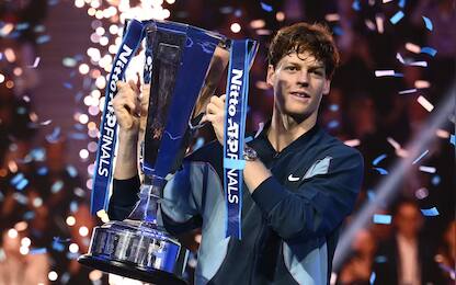 Italy's Jannik Sinner lifts the trophy after winning the final against USA's Taylor Fritz at the ATP Finals tennis tournament in Turin on November 17, 2024. (Photo by Marco BERTORELLO / AFP)