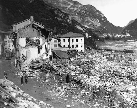 Debris and damaged buildings are all that remain in the Italian village of Longarone after overflowing waters from the Vaiont Dam flooded the village, killing over 2,000 people. October 10, 1963. | Location: Longarone, Italy.