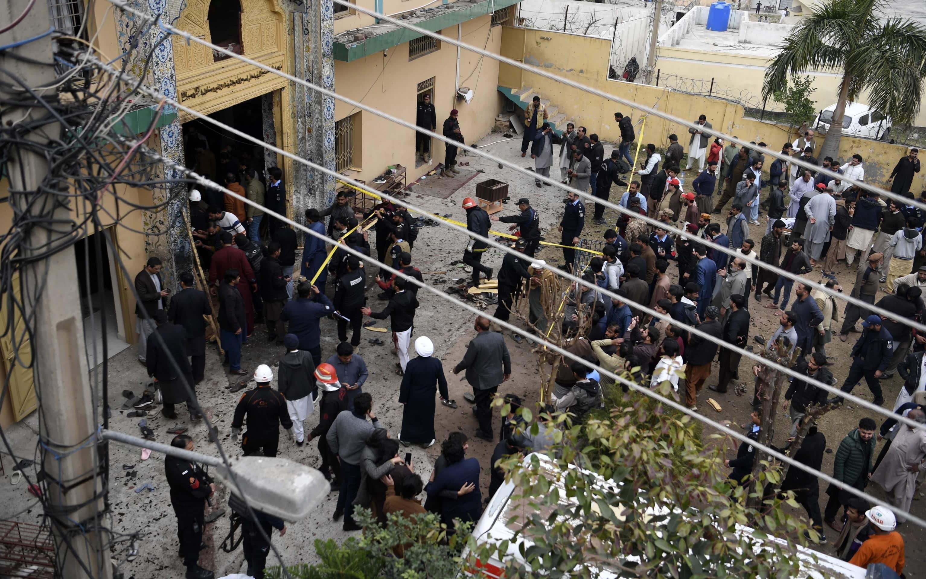 epa12708697 Pakistani security officials inspect the aftermath of a suicide bomb blast at a Shiite Muslim mosque in Islamabad, Pakistan, 06 February 2026. At least 31 people were killed and a larger number of others injured when a bomb exploded during Friday prayers at the Shiite Muslim mosque in Islamabad, police said.  EPA/SOHAIL SHAHZAD