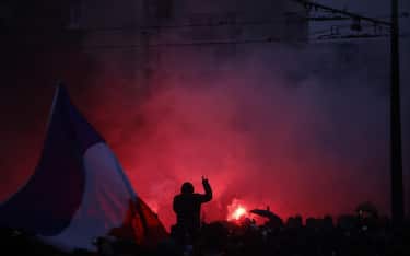 epa13328532 Protesters clash with riot police during a demonstration against rising living costs and cuts to public services in Paris, France, 24 October 2026. Around 70,000 police and security personnel are deployed across France following violent nationwide protests on 17 October 2026 involving Yellow Vest (Gilets Jaunes) activists, high school and university students, trade unions and other groups protesting against rising fuel prices and deteriorating public services.  EPA/YOAN VALAT