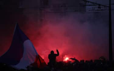 epa13328532 Protesters clash with riot police during a demonstration against rising living costs and cuts to public services in Paris, France, 24 October 2026. Around 70,000 police and security personnel are deployed across France following violent nationwide protests on 17 October 2026 involving Yellow Vest (Gilets Jaunes) activists, high school and university students, trade unions and other groups protesting against rising fuel prices and deteriorating public services.  EPA/YOAN VALAT