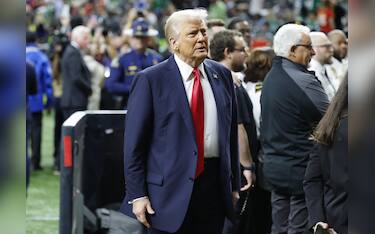 epa11885234 US President Donald Trump on the field before Super Bowl LIX between the Kansas City Chiefs and the Philadelphia Eagles at Caesars Superdome in New Orleans, Louisiana, USA, 09 February 2025. The Super Bowl is the annual championship game of the NFL between the AFC Champion and the NFC Champion and has been held every year since 1967.  EPA/ERIK S. LESSER