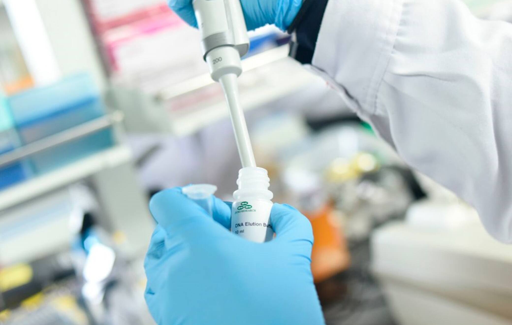 This picture taken on May 14, 2020 shows a researcher at Peking University's Beijing Advanced Innovation Center for Genomics conducting tests at their laboratory in Beijing. - The Chinese laboratory says it has developed a drug it believes has the power to bring the COVID-19 coronavirus pandemic to a halt, shortening the recovery time for those infected and even offering short-term immunity from the virus. (Photo by WANG ZHAO / AFP) / TO GO WITH Health-virus-China-vaccine,FOCUS by Qian Ye and Matthew Knight (Photo by WANG ZHAO/AFP via Getty Images)