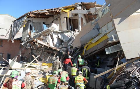 The handout picture released on 26 August 2016 by the Italian Army Press Office shows rescue teams working amid the rubble during search and recovery operations in the Lazio mountain village of Amatrice after the earthquake in central Italy. The Civil Protection Department said Friday the latest provisional death toll from Wednesday' earthquake in central Italy is of 267 dead. Of these, 207 died in the Lazio mountain village of Amatrice, 11 in nearby Accumoli and 49 in the village of Arquata del Tronto, in the neighboring Marche region. ITALIAN ARMY PRESS OFFICE   +++ ANSA PROVIDES ACCESS TO THIS HANDOUT PHOTO TO BE USED SOLELY TO ILLUSTRATE NEWS REPORTING OR COMMENTARY ON THE FACTS OR EVENTS DEPICTED IN THIS IMAGE; NO ARCHIVING; NO LICENSING +++