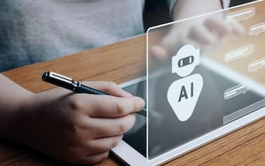 un tablet e la scritta ai