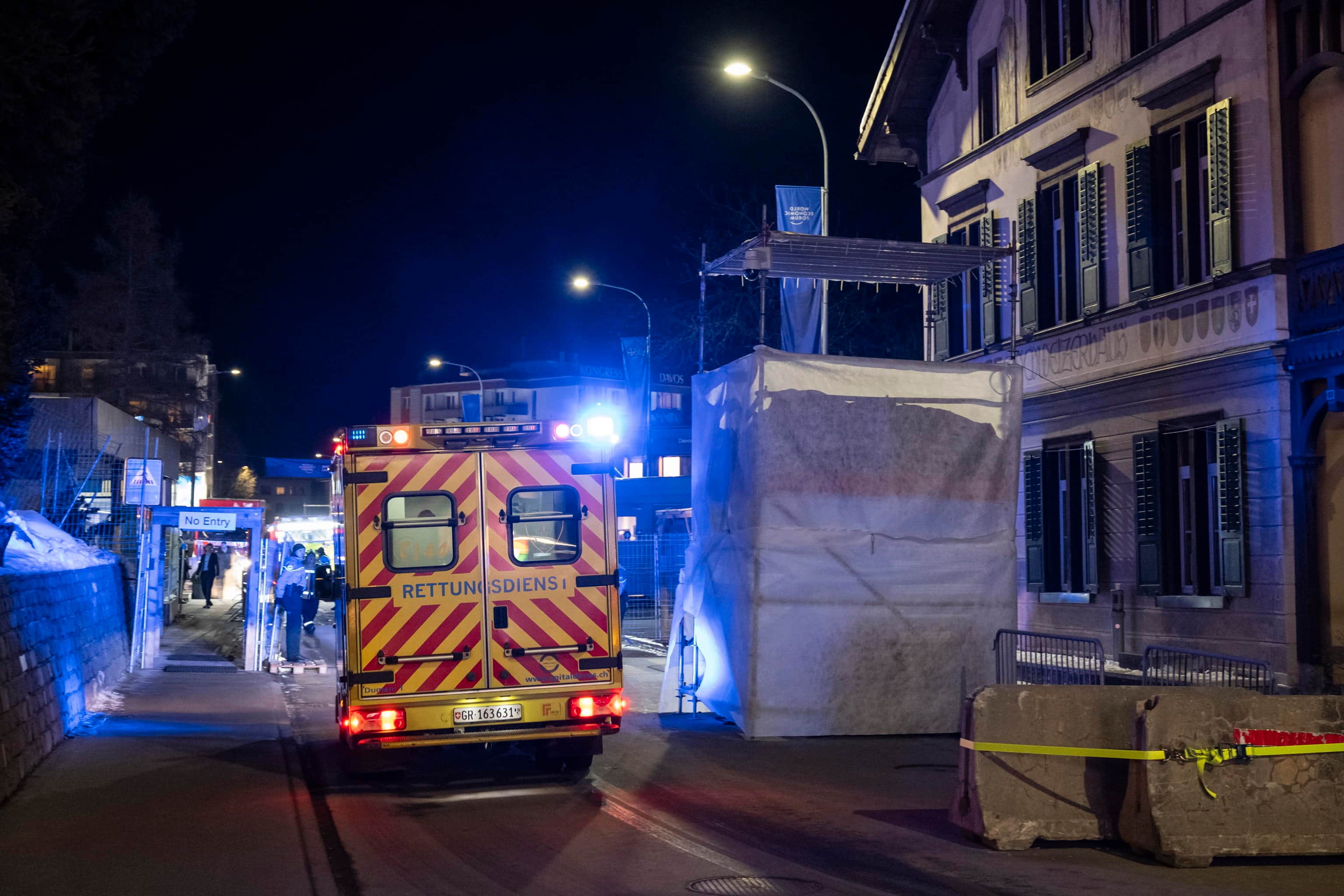 epa12668626 Ambulances and rescue personnel approach the Congress Center following reports of a small fire, during the 56th annual meeting of the World Economic Forum (WEF) in Davos, Switzerland, 21 January 2026. The 2026 summit, running from 19 to 23 January and held under the theme 'A Spirit of Dialogue,' brings together global political leaders, corporate executives, and scientists to address international challenges.  EPA/LAURENT GILLIERON