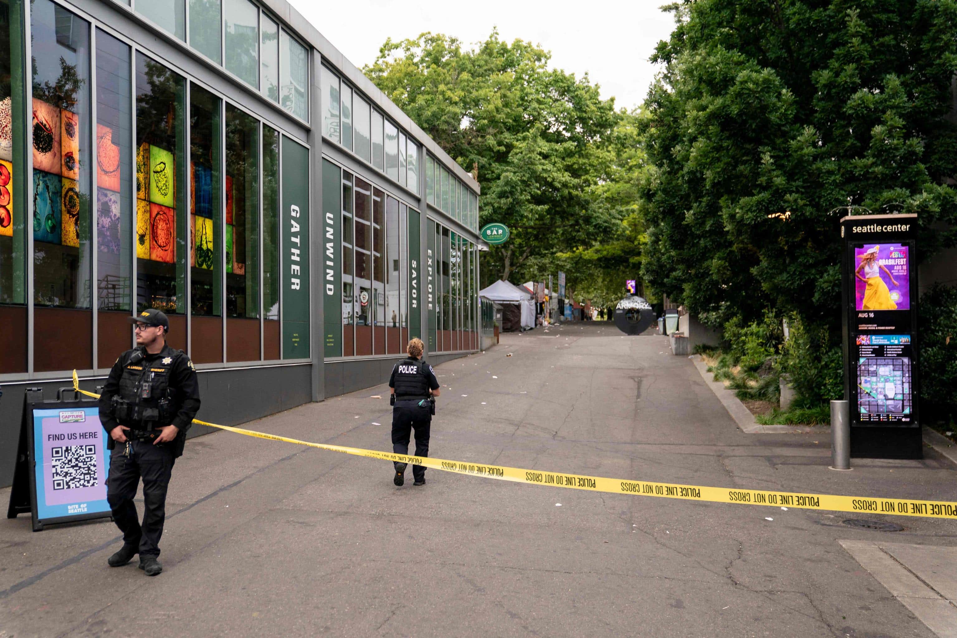 SEATTLE, WASHINGTON - JULY 26: Police officers walk on patrol at the scene of a mass shooting at the Bite of Seattle food festival on July 26, 2026 in Seattle, Washington. At least two people are dead and at least five are wounded after a mass shooting at the event at Seattle Center.   David Ryder/Getty Images/AFP (Photo by David Ryder / GETTY IMAGES NORTH AMERICA / Getty Images via AFP)