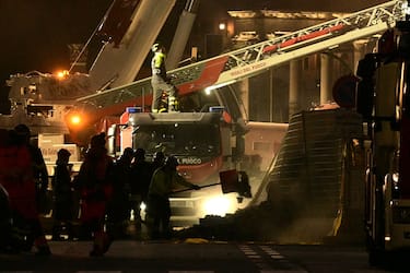 Rescue teams work on the site after a part of medieval tower "Torre dei Conti" collapses near the Roman Forum in the historic center of Rome on November 3, 2025. Three workers inside were evacuated, with one taken to hospital in critical condition, a spokesman for firefighters told AFP. But one worker remained inside, according to an official from the mayor's office. (Photo by Tiziana FABI / AFP) (Photo by TIZIANA FABI/AFP via Getty Images)          