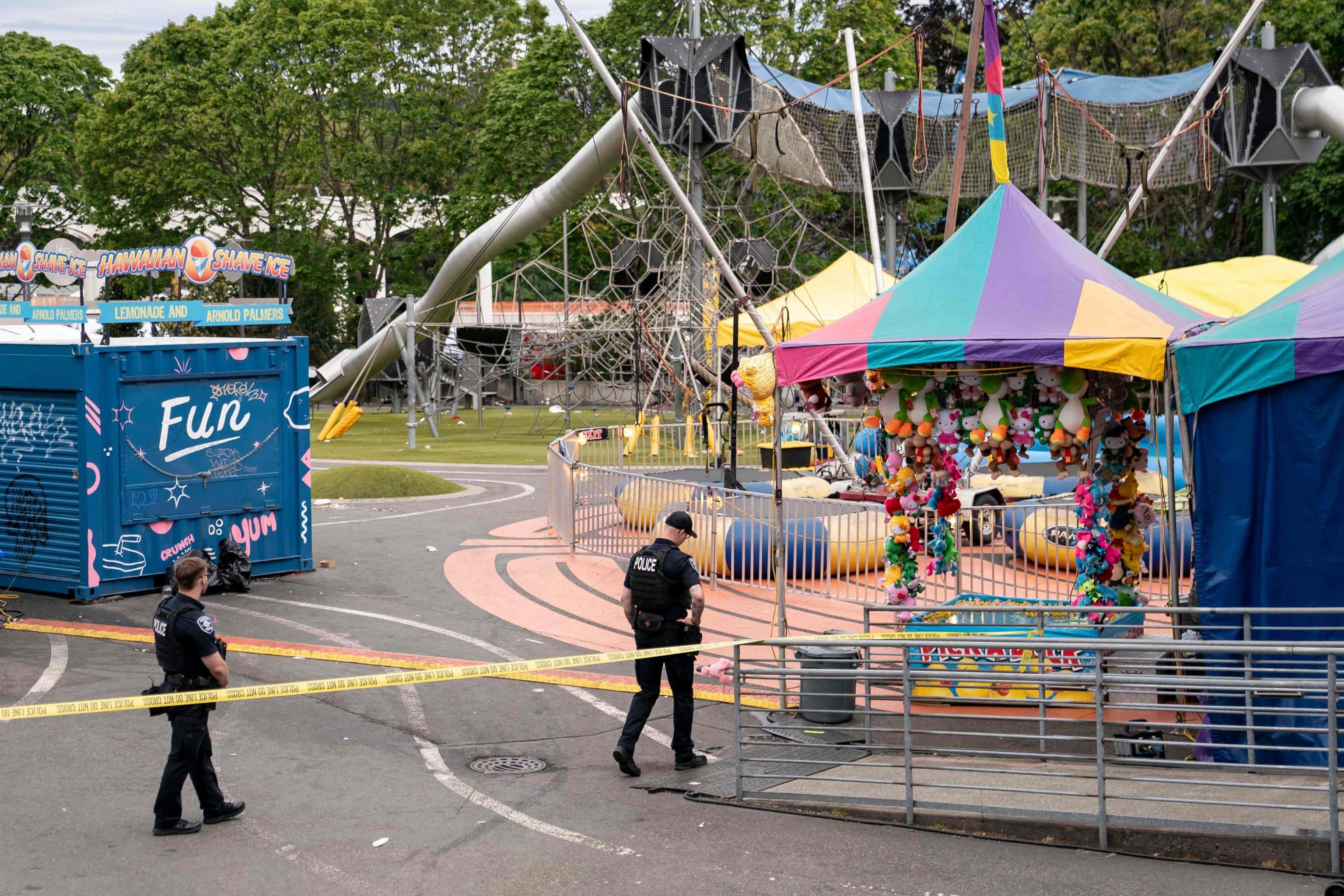 SEATTLE, WASHINGTON - JULY 26: Police officers walk on patrol at the scene of a mass shooting at the Bite of Seattle food festival on July 26, 2026 in Seattle, Washington. At least two people are dead and at least five are wounded after a mass shooting at the event at Seattle Center.   David Ryder/Getty Images/AFP (Photo by David Ryder / GETTY IMAGES NORTH AMERICA / Getty Images via AFP)