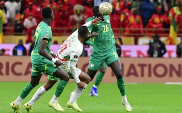 epa12659679 Pape Alassane Gueye (R) of Senegal in action against Ayoub El Kaabi (C) of Morocco during the CAF Africa Cup of Nations 2025 final match between Senegal and Morocco in Rabat, Morocco, 18 January 2026.  EPA/JALAL MORCHIDI