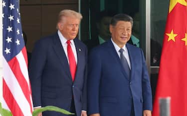 epa12492356 US President Donald Trump (L) and Chinese President Xi Jinping (C) emerge from their talks at the Naraemaru reception hall inside an Air Force base in Busan, South Korea, 30 October 2025.  EPA/YONHAP SOUTH KOREA OUT