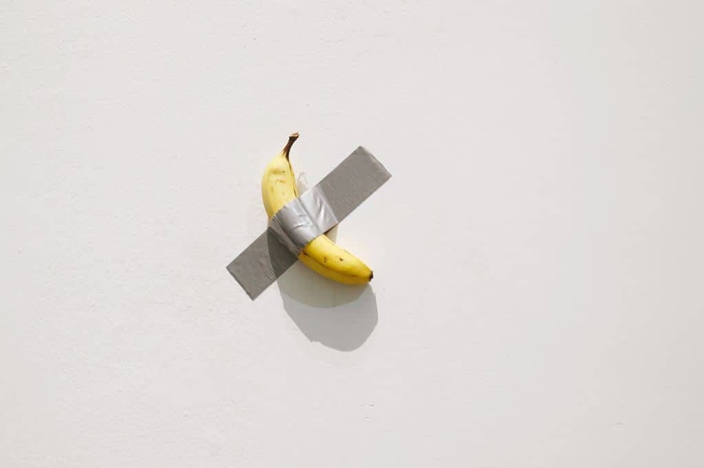 BEIJING, CHINA - NOVEMBER 20: A general view shows 'Comedian', a banana duct-taped to a wall, during the solo exhibition 'The Last Judgment' by Italian artist Maurizio Cattelan at UCCA Great Hall on November 20, 2021 in Beijing, China. (Photo by Han Haidan/China News Service via Getty Images)
