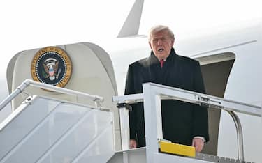 US President Donald Trump steps off Air Force One upon arrival at Zurich Airport on January 21, 2026. The World Economic Forum takes place in Davos from January 19 to January 23, 2026. (Photo by Mandel NGAN / AFP via Getty Images)