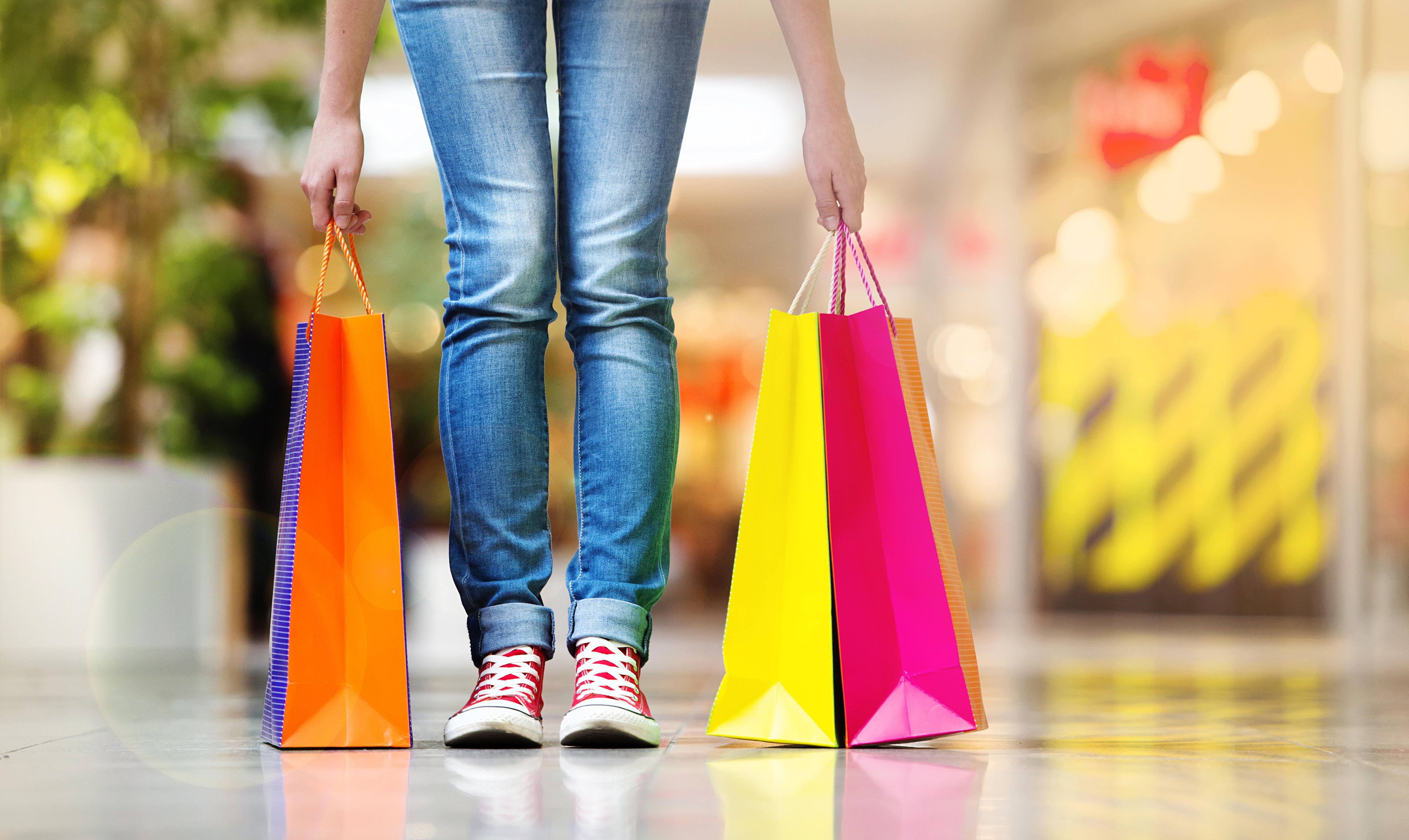 Shopping time, young teenage girl with shopping bags at shopping mall