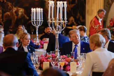 epa12195629 Italian Prime Minister Giorgia Meloni (L), US President Donald Trump (3-R) and Dutch King Willem-Alexander (2-R) preceded a dinner with heads of state and government at Paleis Huis Ten Bosch at the invitation of Dutch King Willem-Alexander, in The Hague, The Netherlands, 24 June 2025. The dinner marks the start of the NATO summit in The Hague. The Netherlands hosts the NATO Summit in The Hague on 24 and 25 June, the first such summit to be held in the country.  EPA/REMKO DE WAAL / POOL