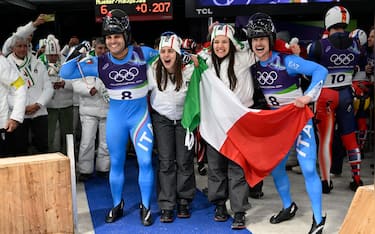 epa12728423 Emanuel Rieder and Simon Kainzwaldner celebrate with  Andrea Voetter and Marion Oberhofer of Italy during the Men's Doubles of the Luge competitions at the Milano Cortina 2026 Winter Olympic Games, in Cortina d'Ampezzo, Italy, 11 February 2026.  EPA/DANIEL DAL ZENNARO