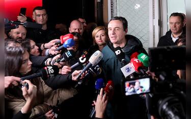 epa11885264 Incumbent Prime Minister and leader of 'Vetevendosje' party, Albin Kurti (C) addresses the media after winning the parliamentary elections in Pristina, Kosovo, 09 February 2025. The Republic of Kosovo held the parliamentary elections with Kurti's party leading with 42 percent of the vote, a drop from the 50 percent Kurti received in 2021.  EPA/GEORGI LICOVSKI